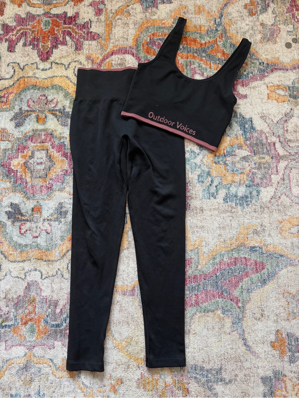 Outdoor Voices Black Sports Bra with Pink Trim & Black High-Waist Leggings